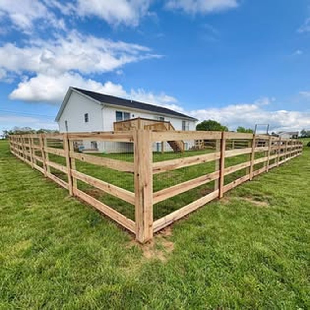 Three-rail board fence installation